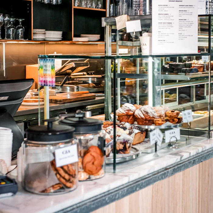 A glass counter full of pastries
